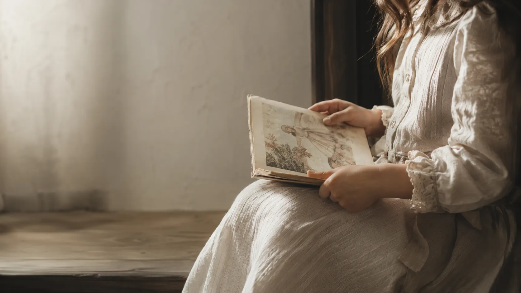 A young girl holding an illustrated storybook in soft natural light, created as a conceptual visual for On Memory.